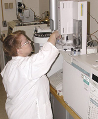 Medallion Laboratories Chemist Heather Newcomb conducts a gas chromatographic fat analysis by AOAC Method 996.06.