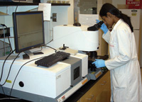 OSU graduate student Veena Prabhakar uses a Varian FTIR microscope to “fingerprint” a Salmonella isolate. 
