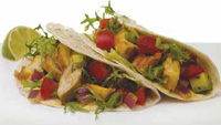 Here’s one example of thinking outside the pork chop. Take grilled chicken, season it with turmeric, an Indian spice, add a salsa made with tomatoes and avocados, and serve it as a wrap with a flavor twist.