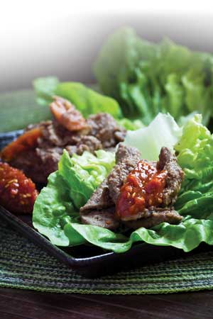 Ssamjang sauces made with gochujang on lettuce leaves.