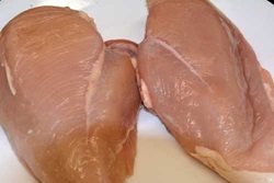 Chicken breast on left has telltale markings of white striping.