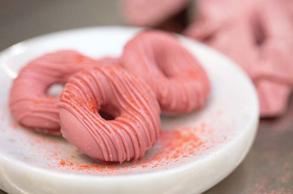 Pink-glazed confections.