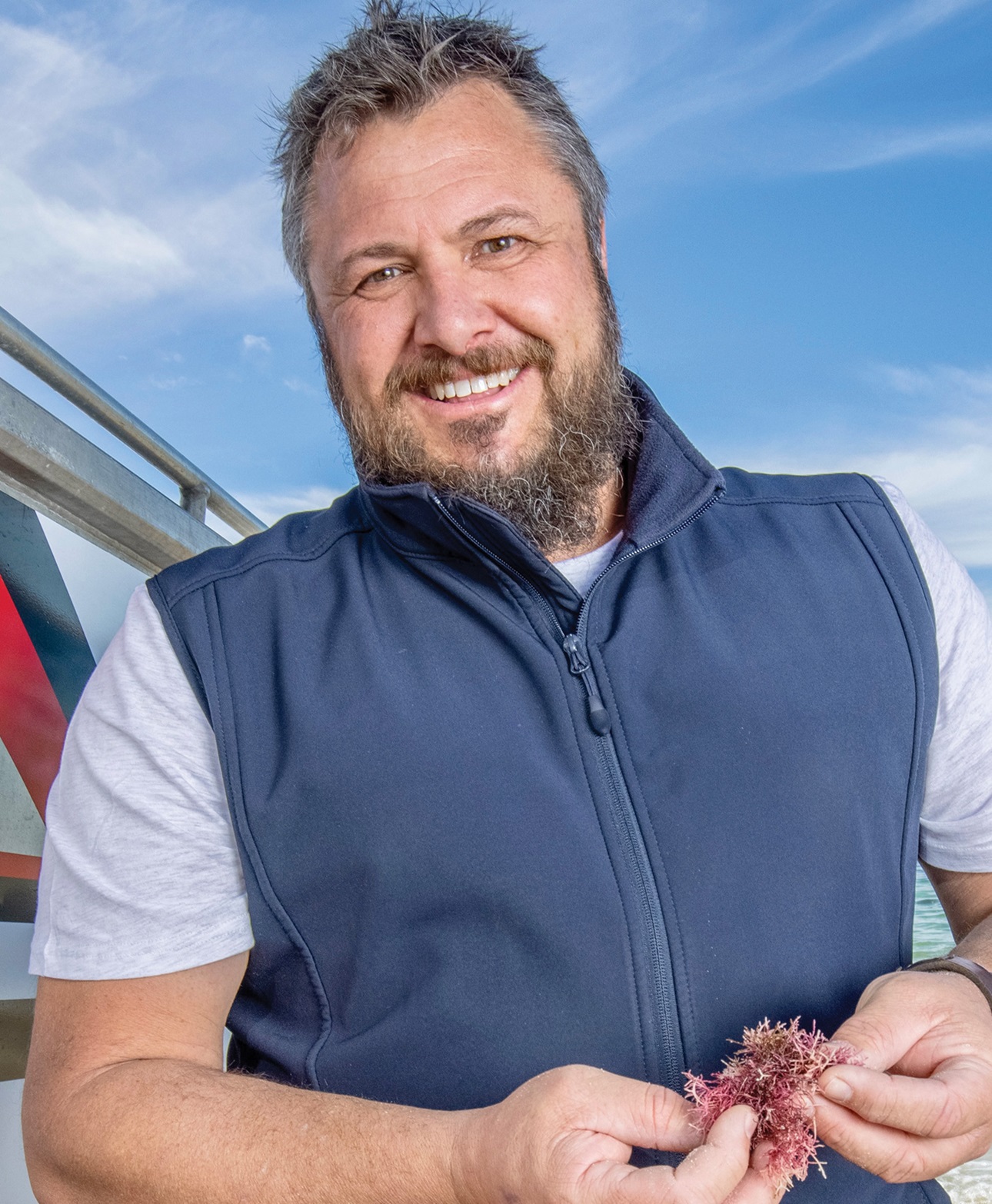 Adam Main of CH4 shows off the red seaweed cultivated in Australia