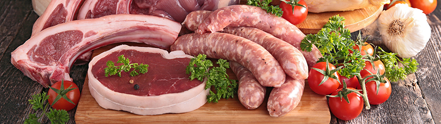 Muscle Foods Division closeup on meats, sausage, tomatoes