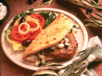 Today’s eating experience is becoming more of an adventure to different parts of the world. This Greek turkey burger, an example of how traditional foods can be globalized, is made with feta cheese, olive oil, pimento-stuffed olives, cinnamon, sour cream, and cucumbers, and then wrapped in pita bread.