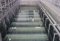 Aerobic treatment system, the Membrane Biological Reactor from ADI Systems Inc., is based on the Kubota flat-membrane concept. Photo shows the membrane basin during clean water testing.