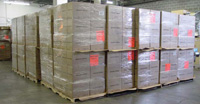 Pallet load of same-size cases. Corrugated fi berboard cases are stacked on grocery pallets, and the loads are stabilized with stretch fi lm. Slip sheets are shown between tiers. Loading different-size primary and secondary food packages on a single pallet in random patterns would not necessarily protect the packages or the product during their trip from the distribution warehouse to the store shelf.