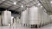 Used stainless steel tanks can each hold up to 10,000 gal of food-grade materials