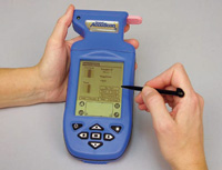 Handheld lateral flow reader from Neogen interprets and stores results from any of the company’s AflatoxinReveal tests.