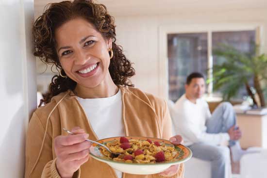 Woman eating cereal