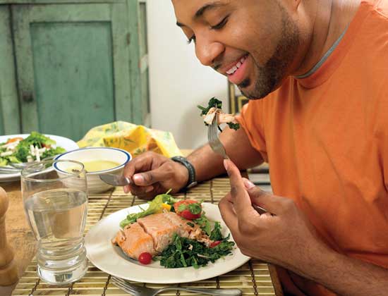 Man eating salmon