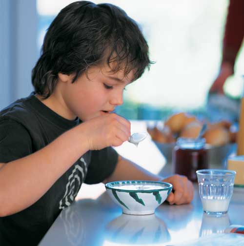 Boy eating yogurt