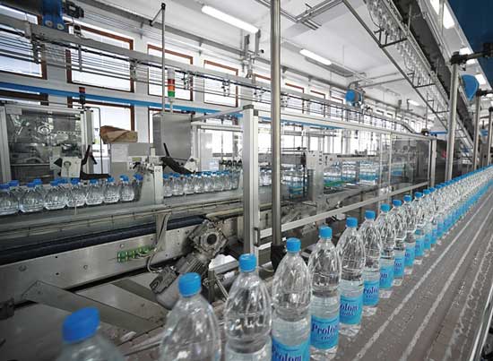 Prolom water in bottles on assembly line. 