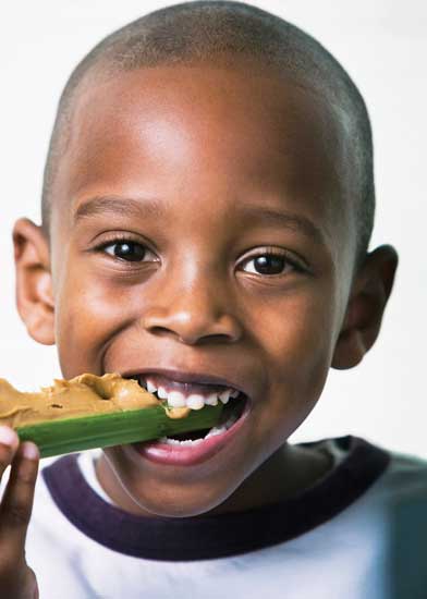 Child eating peanut butter