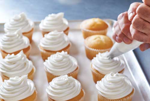 Frosting cupcakes