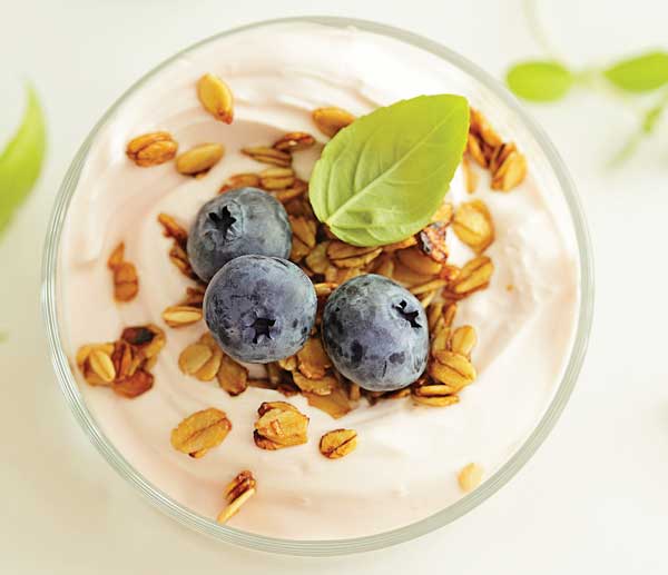 Soluble corn fiber incorporated with whole grains on top of yogurt.