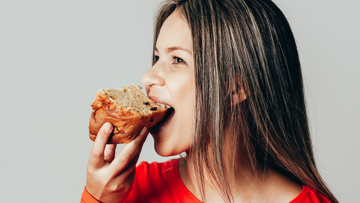 Woman eating bread