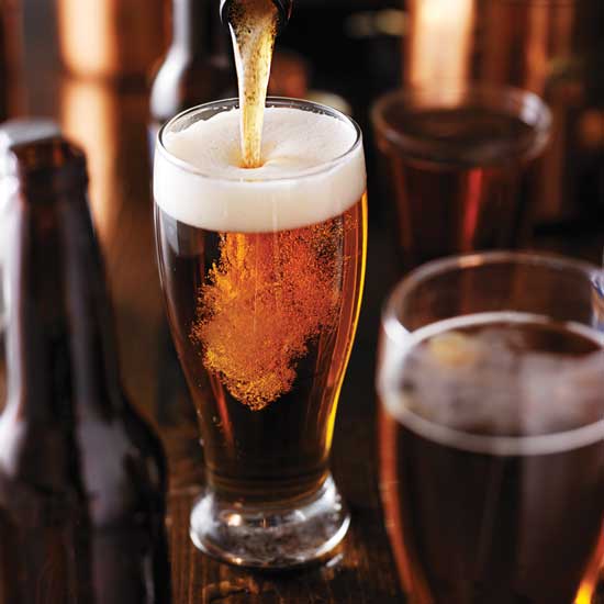 Beer poured into glass.