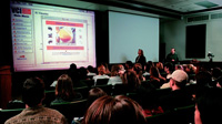 Author Schmidt, with author Javenkoski in the background, demonstrates to students in the Food Science and Human Nutrition 101 course how they can, at any time from any location, use a Web browser to access the online course resources that complement the content taught during classroom lectures.