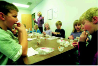 Fourth-graders finish their samples after completing their descriptive analysis of different brands of peanut butter. Photo courtesy of M. Swaney-Stueve.