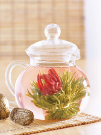 Flowering tea from Numi Tea, Inc. slowly blossoms into breathtaking shapes when steeped. Freshly picked white, green, and black tea leaves are flattened while damp and sewn with cotton thread into elaborate designs, which are then shaped into balls, mushrooms, or cones. The teas then go through drying, oxidation, and firing processes.