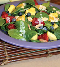 From the Volumetrics Eating Plan, fresh fruit and spinach salad with orange-poppy seed dressing has 150 calories, 30 g carb, 2 g fat, 4 g protein, 8 g fiber, and low energy density of 0.64.