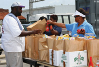 IFT Cares volunteers distribute food and provide support to needy families.