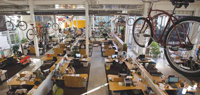 Used bicycles serve as decorative touches in Clif Bar’s energy-efficient headquarters in Emeryville, Calif. Inset: Clif Bar buys bikes for employees who wish to use them to commute to work.