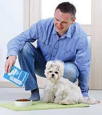 Man feeding his dog