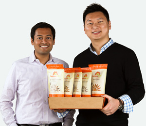 NatureBox co-founders Gautam Gupta (left) and Ken Chen show off a monthly snack package. Photo courtesy of NatureBox