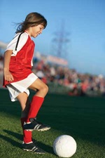 Child playing soccer