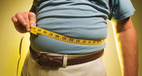 Man taking waist measurement