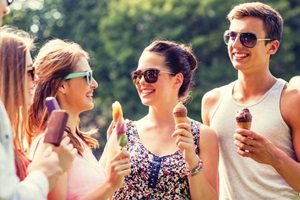 Young people enjoying frozen treats.