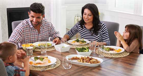 Latin American family enjoying meal