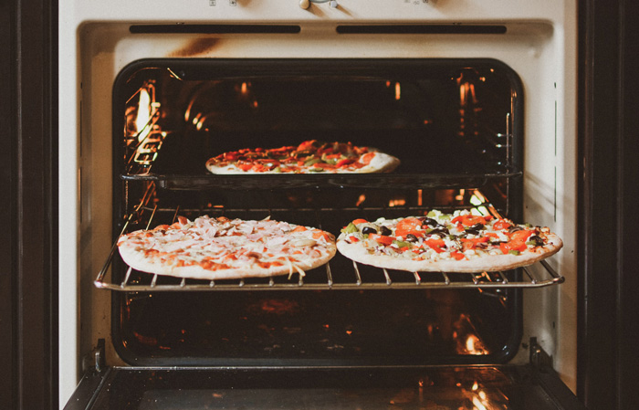 Three Pizza's in vintage oven