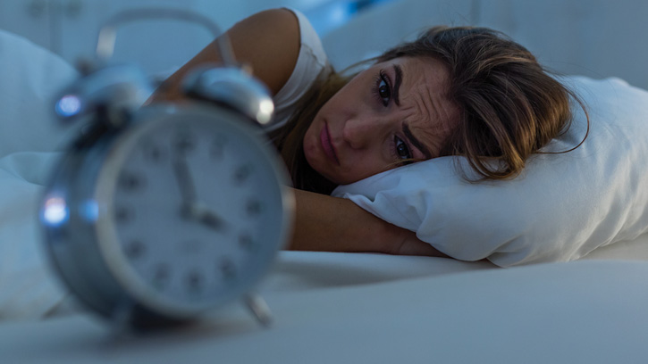 Woman Staring at alarm clock