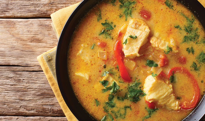 Brazilian food: Moqueca Baiana of fish and bell peppers in spicy coconut sauce
