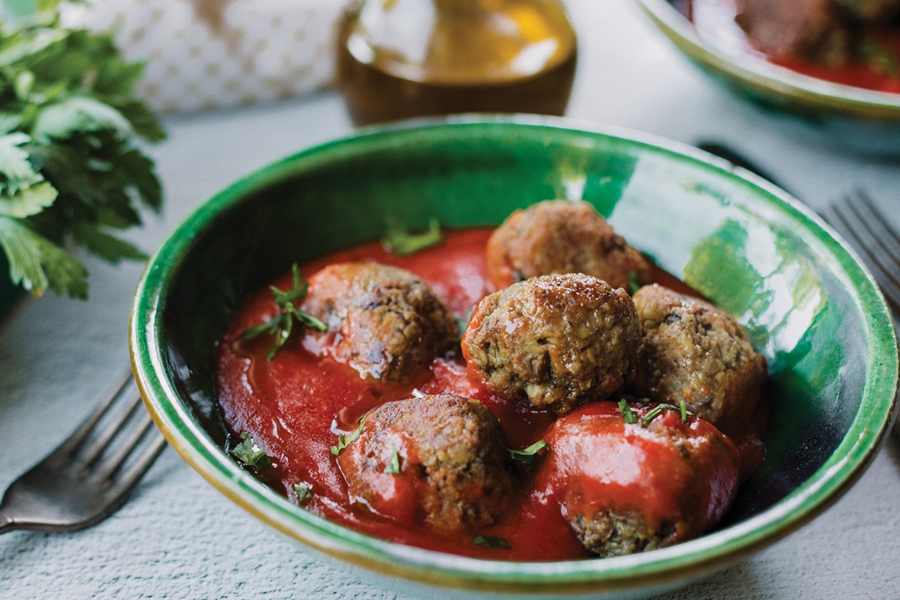 Vegan meatballs in tomato soup.