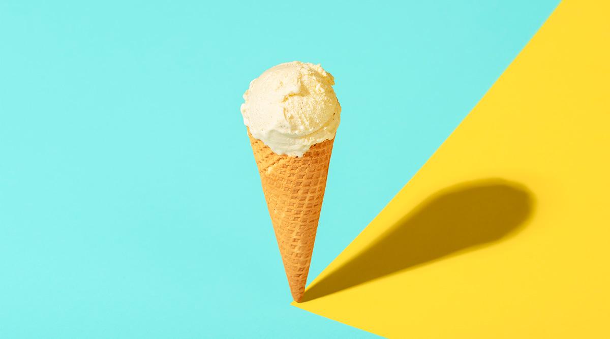 A scoop of ice cream on a sugar cone