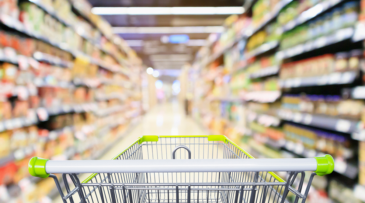 cart in grocery store aisle