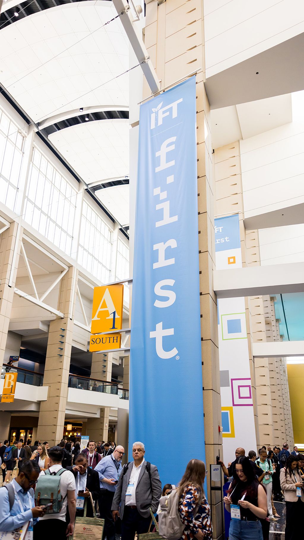IFT FIRST signage outside of expo hall as attendees wait for the opening.