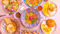 Colorful food recipe dish set, with casseroles, appetizers, gyozas, burgers with potatoes and spices.