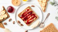 Homemade peanut butter sandwiches with raspberry jam and banana.