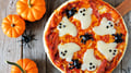 Halloween pizza with ghosts and spiders.