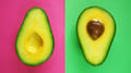Halves of cut ripe avocado on pink and green background.