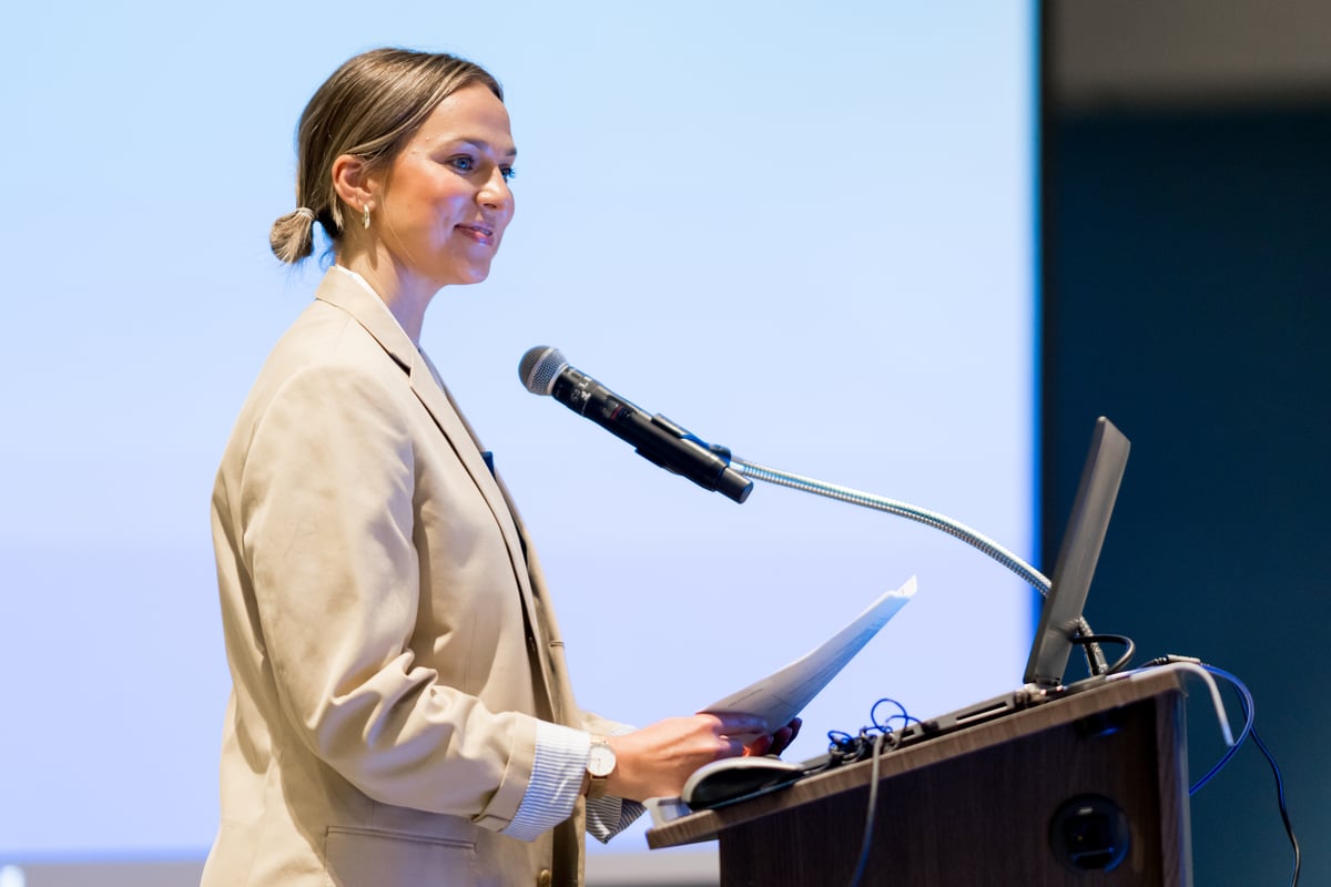image of student standing at podium