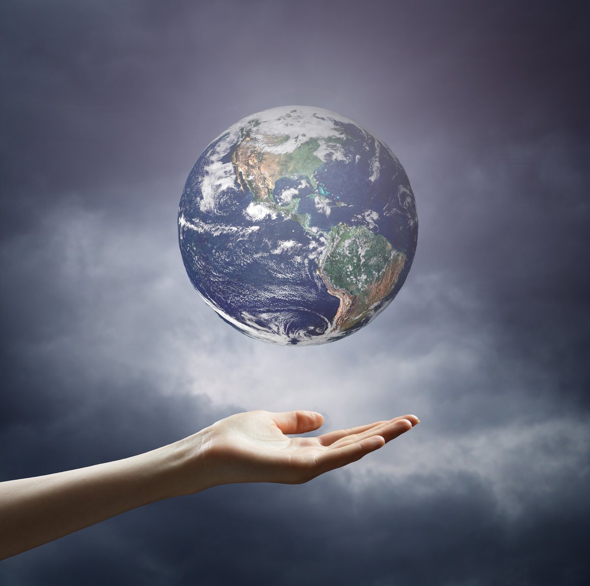 hand over floating globe