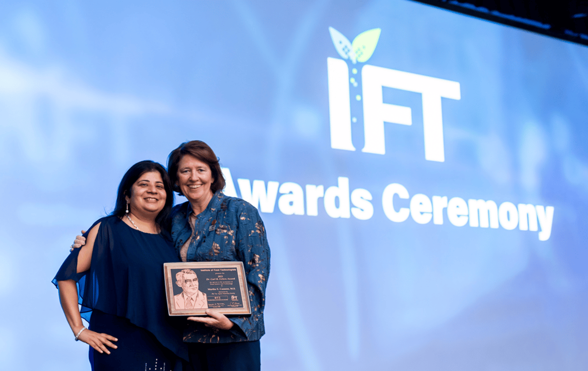 Two award recipients standing on stage at the IFT Awards Ceremony.