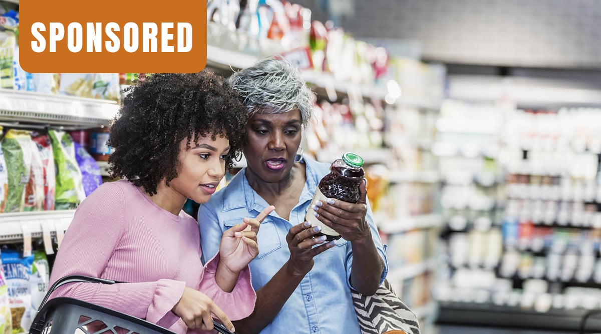 Sponsored. Two African American women shopping in the grocery store