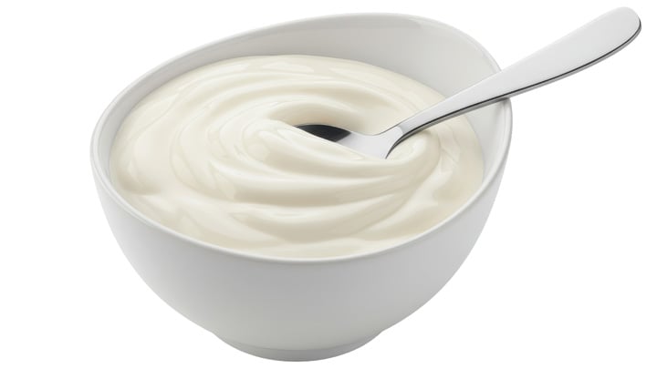 Isolated Bowl of Yogurt with Spoon.
